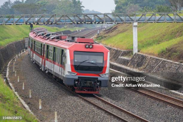 train passing through countryside - commuter train stock pictures, royalty-free photos & images