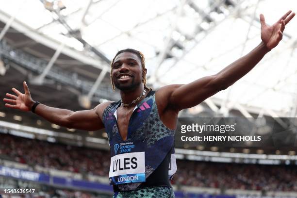 S Noah Lyles celebrates winning the men's 200m event during the IAAF Diamond League athletics meeting at the London Stadium in the Stratford district...