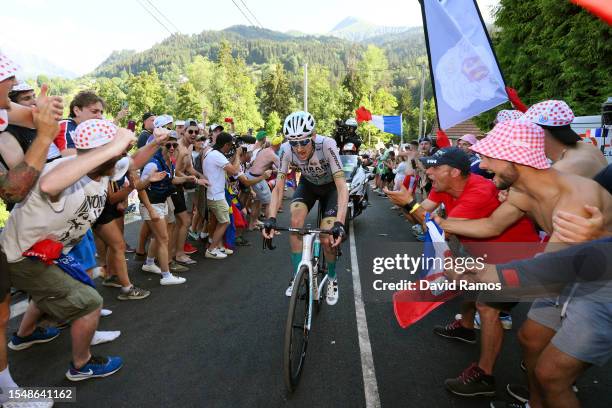 Wout Poels of The Netherlands and Team Bahrain Victorious competes in the breakaway climbing to the Saint-Gervais Mont-Blanc while fans cheer during...