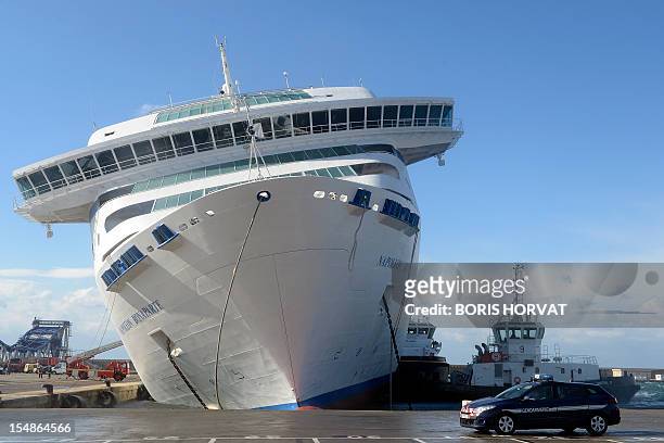 The ferry "Napoleon-Bonaparte" of French SNCM company, which manages Mediterranean sea transport shuttles, tilts to the side against a quay, on...