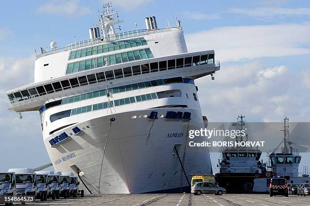 The ferry "Napoleon-Bonaparte" of French SNCM company, which manages Mediterranean sea transport shuttles, tilts to the side against a quay, on...