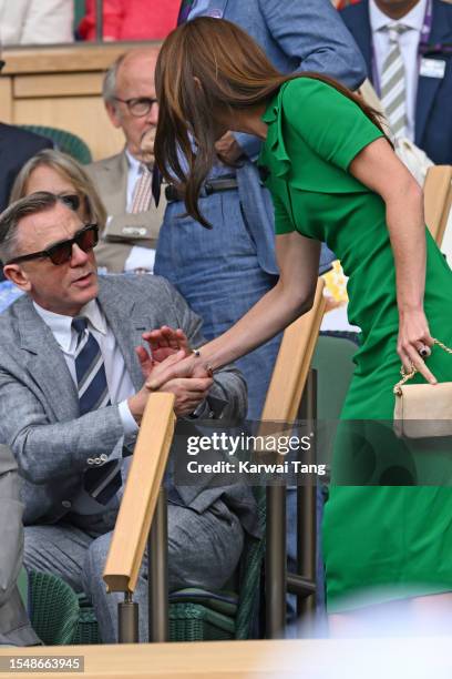 Daniel Craig and Catherine, Princess of Wales shake hands court-side during Carlos Alcaraz vs Novak Djokovic in the Wimbledon 2023 men's final on...