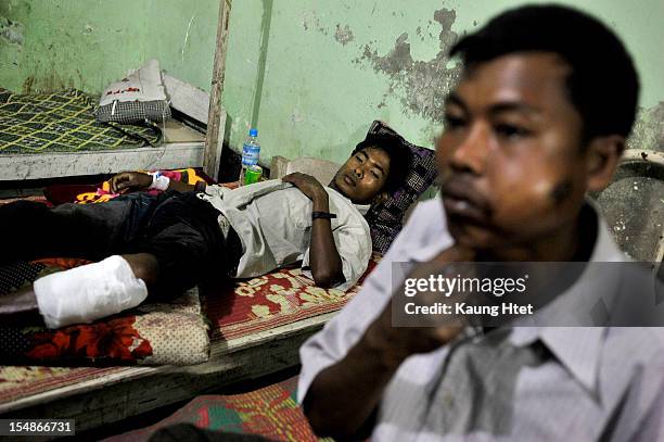 Gun shot victims receive treatment in Kyauk Taw township hospital on October 25, 2012 in Kyauk Taw, Myanmar. Over twenty thousand people have been...