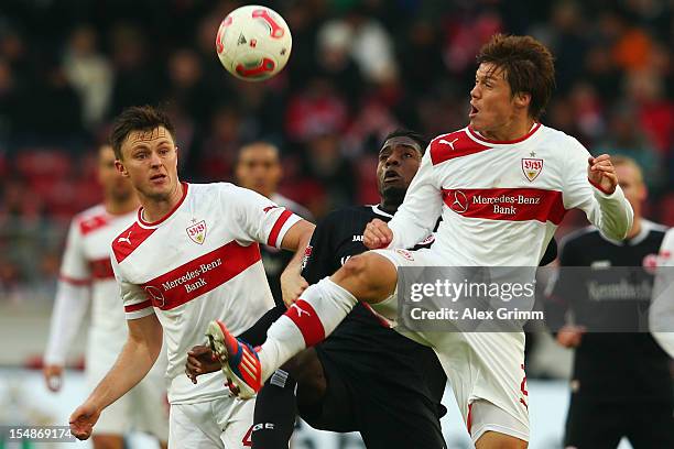 Olivier Occean of Frankfurt is challenged by William Kvist and Gotoku Sakai of Stuttgart during the Bundesliga match between VfB Stuttgart and...