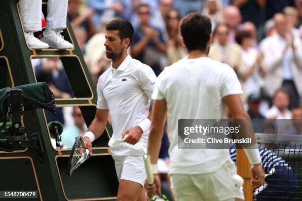 Novak Djokovic of Serbia smashes his racket during the Men's Singles Final against Carlos Alcaraz of Spain on day fourteen of The Championships...