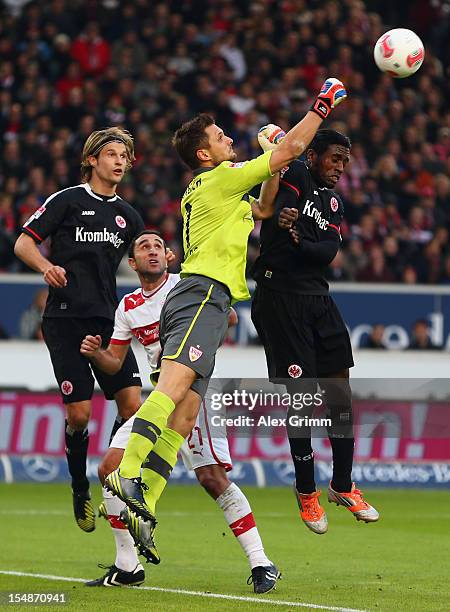 Goalkeeper Sven Ulreich of Stuttgart clears the ball ahead of Olivier Occean and Martin Lanig during the Bundesliga match between VfB Stuttgart and...