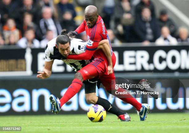 Youssouf Mulumbu of West Bromwich Albion challenges Jonas Gutierrez of Newcastle United during the Barclays Premier League match between Newcastle...