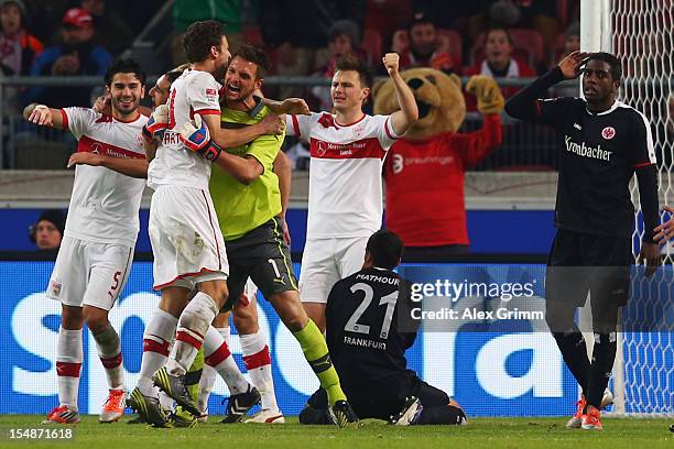 Players of Stuttgart celebrate as Karim Matmour and Olivier Occean react after the final whistle of the Bundesliga match between VfB Stuttgart and...