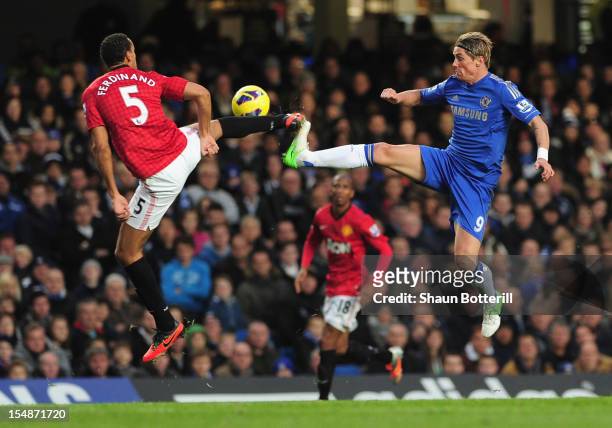 Fernando Torres of Chelsea challenges for the ball with Rio Ferdinand of Manchester United during the Barclays Premier League match between Chelsea...