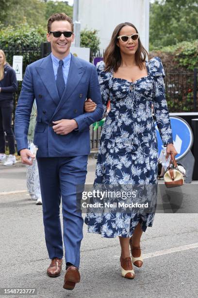 Tom Hiddleston and Zawe Ashton attend day fourteen of the Wimbledon Tennis Championships at All England Lawn Tennis and Croquet Club on July 16, 2023...