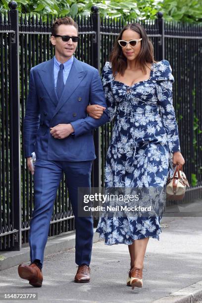 Tom Hiddleston and Zawe Ashton attend day fourteen of the Wimbledon Tennis Championships at All England Lawn Tennis and Croquet Club on July 16, 2023...