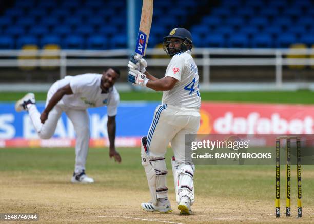 Rohit Sharma , of India, fails in his attempt at hitting Shannon Gabriel , of West Indies, for 6 during the fourth day of the second Test cricket...