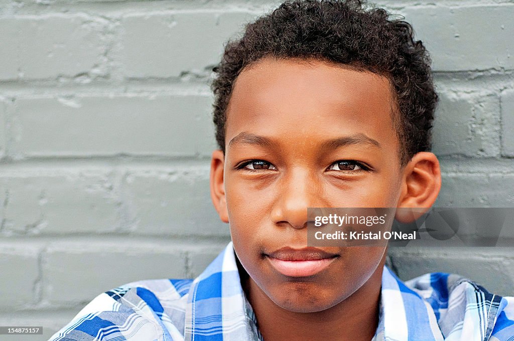 Teen boy with curly hair and dimples