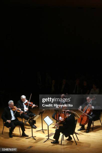 Guarneri String Quartet performing at the Metropolitan Museum on Saturday night, May 16, 2009.This image;The Guarneli String Quartet plus the cellist...