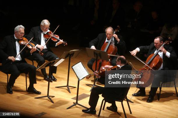 Guarneri String Quartet performing at the Metropolitan Museum on Saturday night, May 16, 2009.This image;The Guarneli String Quartet plus the cellist...