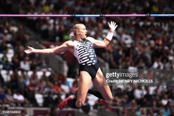 S Katie Moon reacts after clearing the bar as she competes in the women's pole vault event during the IAAF Diamond League athletics meeting at the...