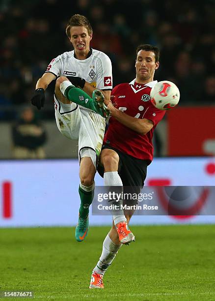 Mario Eggimann of Hannover and Patrick Herrmann of Gladbach battle for the ball during the Bundesliga match between Hannover 96 and Borussia...