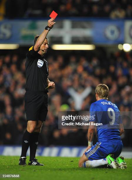Fernando Torres of Chelsea is shown the red card by referee Mark Clattenburg during the Barclays Premier League match between Chelsea and Manchester...