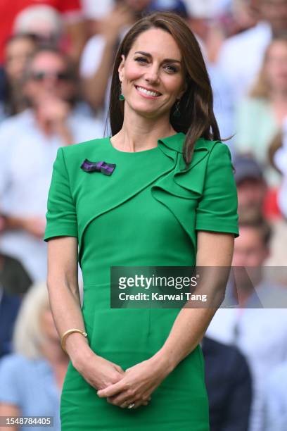 Catherine, Princess of Wales on Centre Court to present Carlos Alcaraz with the Wimbledon gentlemen's singles trophy during day fourteen of the...