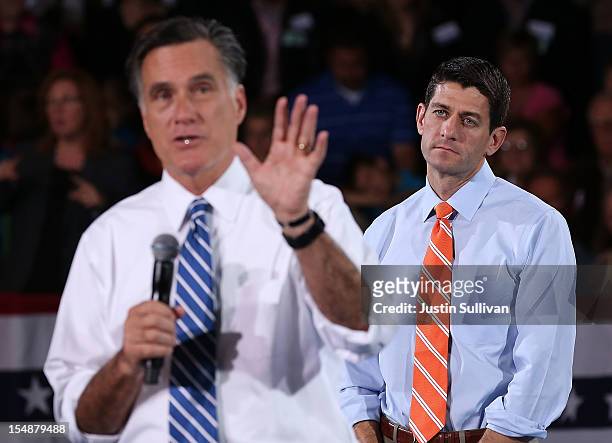 Republican vice presidetial candidate U.S. Sen. Paul Ryan looks on as Republican presidential candidate, former Massachusetts Gov. Mitt Romney speaks...