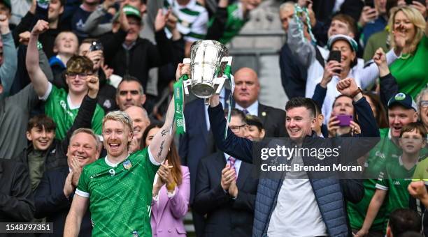 Dublin , Ireland - 23 July 2023; Limerick players Cian Lynch, left, and Declan Hannon lift the Liam MacCarthy Cup after his side's victory in the GAA...