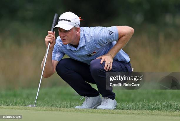 Adam Long of the United States lines up a putt on the fifth green during the final round of the Barbasol Championship at Keene Trace Golf Club on...