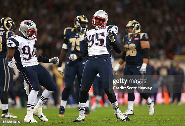 Justin Francis of the New England Patriots and Chandler Jones of the New England Patriots celebrate after sacking the quarterback during the NFL...