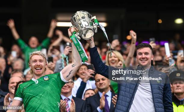 Dublin , Ireland - 23 July 2023; Limerick players Cian Lynch, left, and Declan Hannon lift the Liam MacCarthy Cup after his side's victory in the GAA...