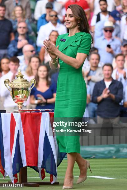 Catherine, Princess of Wales on Centre Court to present Carlos Alcaraz with the Wimbledon gentlemen's singles trophy during day fourteen of the...