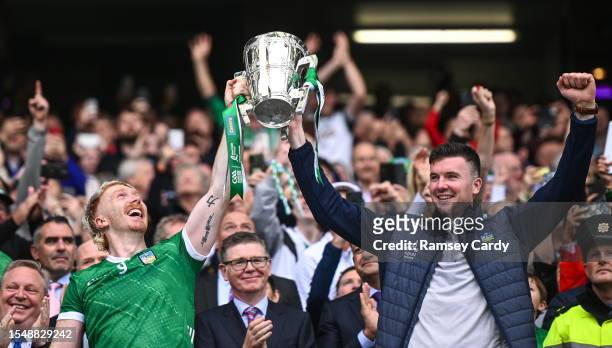 Dublin , Ireland - 23 July 2023; Limerick players Cian Lynch, left, and Declan Hannon lift the Liam MacCarthy Cup after his side's victory in the GAA...