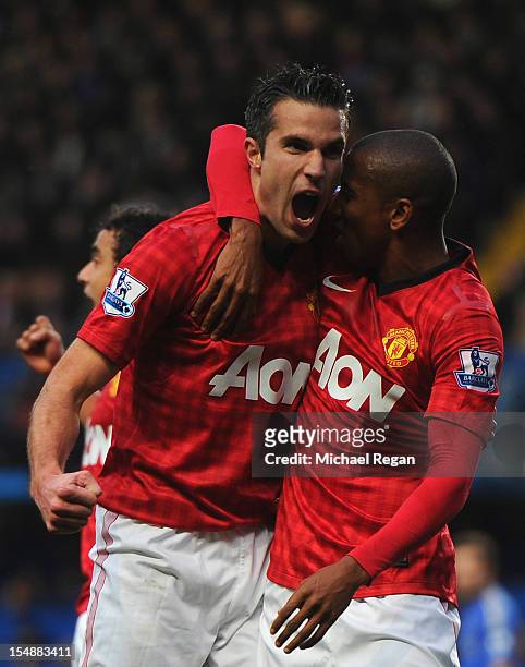 Robin van Persie of Manchester United celebrates scoring the second goal with Ashley Young during the Barclays Premier League match between Chelsea...