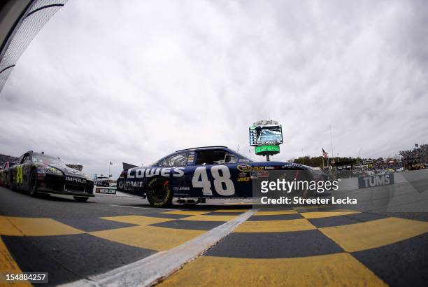 Jimmie Johnson, driver of the Lowe's Chevrolet, leads Jeff Gordon, driver of the Pepsi Max Chevrolet, during the NASCAR Sprint Cup Series Tums Fast...