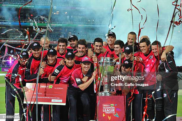 The Sydney Sixers celebrate with the trophy after winning the Karbonn Smart CLT20 Final match between bizhub Highveld Lions and Sydney Sixers at...