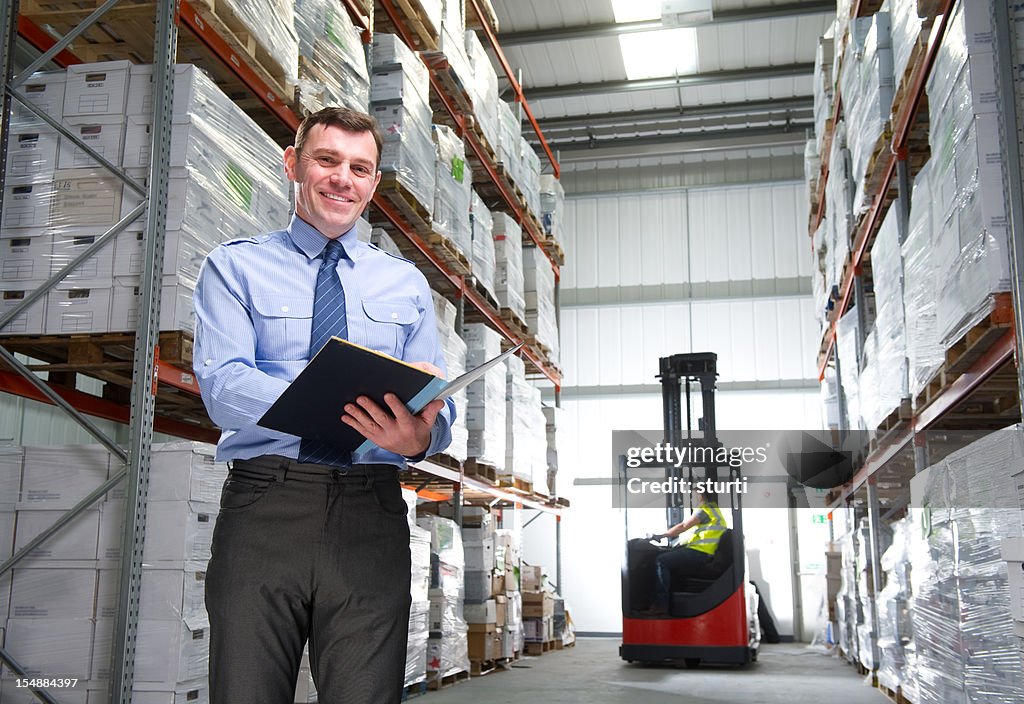 Manager Smiling in a Warehouse