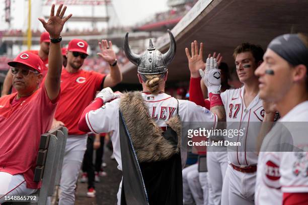 Jake Fraley of the Cincinnati Reds celebrates with teammates after hitting a two-run home run during the third inning against the Milwaukee Brewers...