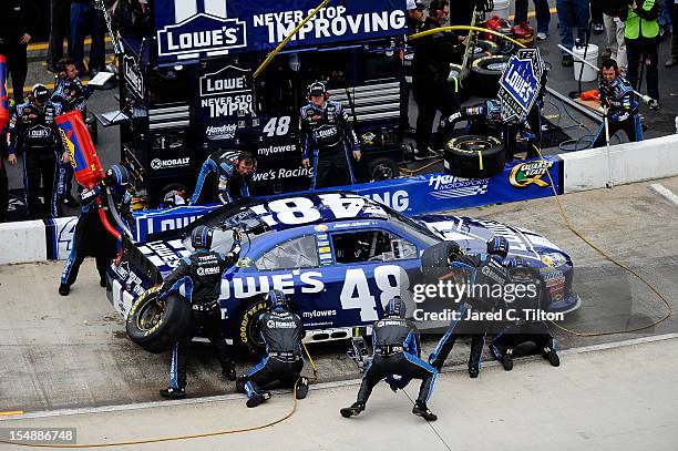 Jimmie Johnson, driver of the Lowe's Chevrolet, pits during the NASCAR Sprint Cup Series Tums Fast Relief 500 at Martinsville Speedway on October 28,...