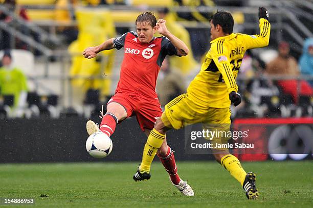 Terry Dunfield of Toronto FC takes control of the ball in front of Jairo Arrieta of the Columbus Crew in the first half on October 28, 2012 at Crew...