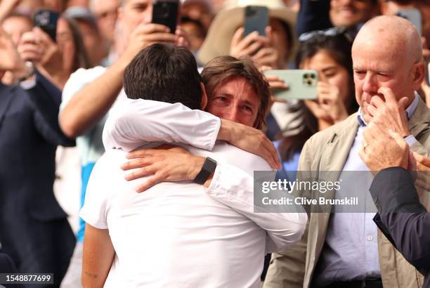 Carlos Alcaraz of Spain celebrates victory with his coach, Juan Carlos Ferrero following the Men's Singles Final against Novak Djokovic of Serbia on...