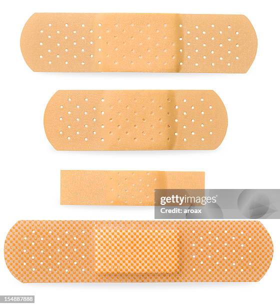 bandaid cuatro tamaño - esparadrapo fotografías e imágenes de stock