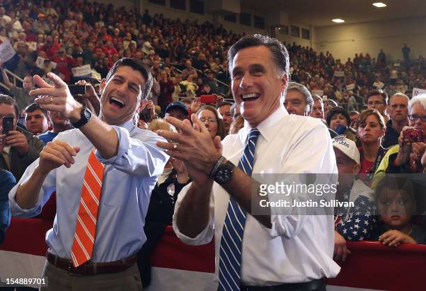 Republican presidential candidate, former Massachusetts Gov. Mitt Romney and his running mate U.S. Sen. Paul Ryan laugh as they watch a performance...