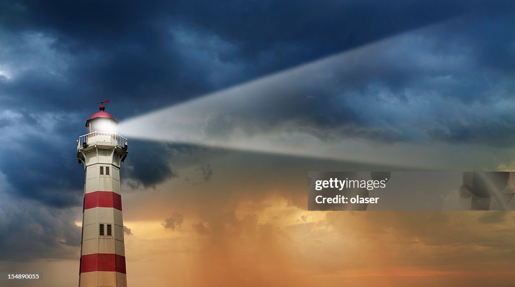 Lighthouse at dawn, bad weather in background