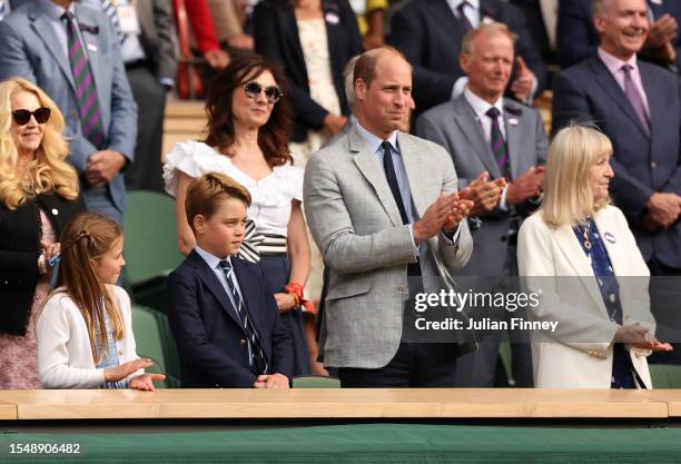 Princess Charlotte of Wales, Prince George of Wales and Prince William, Prince of Wales, are seen in the Royal Box during the Men's Singles Final...