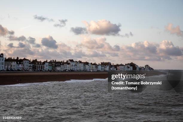 beachside charm: tranquil evening in delightful deal - sea stock pictures, royalty-free photos & images