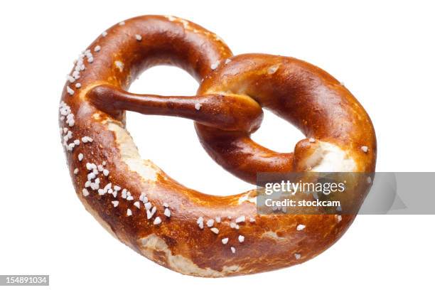 german bread pretzel on a white background - pretzel stockfoto's en -beelden