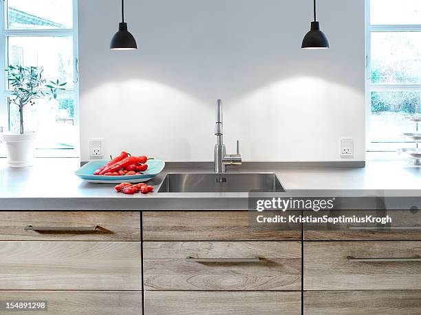 kitchen table and sink - metal kitchen worktop stock pictures, royalty-free photos & images