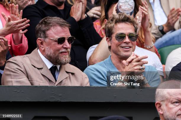 Guy Ritchie and Brad Pitt look on during the Men's Single final match between Novak Djokovic of Serbia and Carlos Alcaraz of Spain during day...