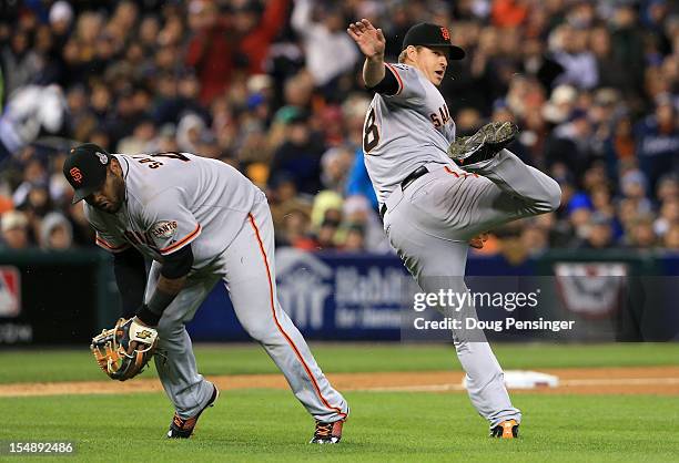 Pablo Sandoval of the San Francisco Giants fields a bunt by Quintin Berry of the Detroit Tigers against Matt Cain in the third inning during Game...