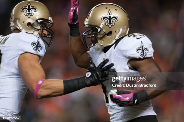 Running back Darren Sproles and tight end Jimmy Graham of the New Orleans Saints celebrate a second quarter Sproles touchdown during a game against...