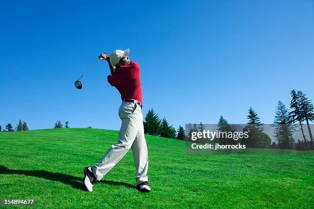 golf swing - young men golfing stock pictures, royalty-free photos & images