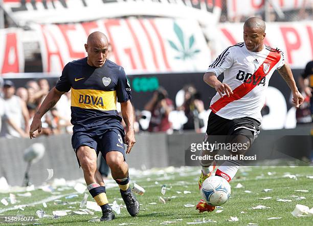 Sanchez of River Plarte and Clemente Rodriguez of Boca Jr struggles for the ball during the match between River Plate and Boca Jr as part of the...